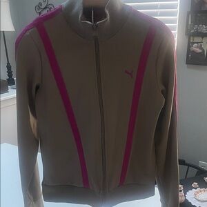 Women's Puma Tan Jacket with Pink Accents and side pockets.